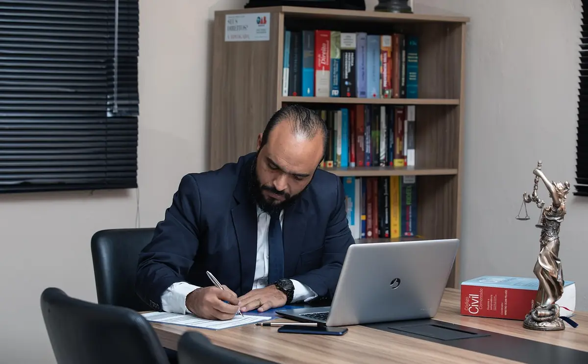 Man, lawyer, office — illustrating Business Card Etiquette