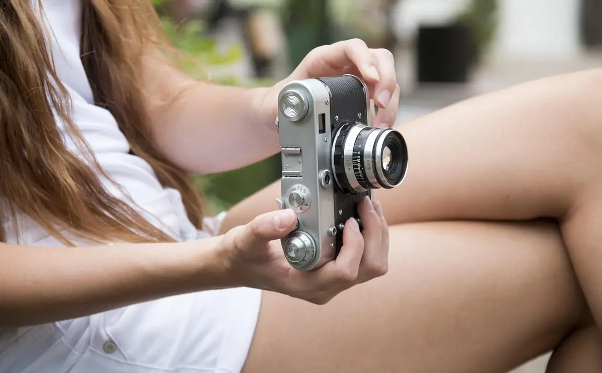 Girl, camera, photos — illustrating 8 Free Image Tools for Web Designers (2026)