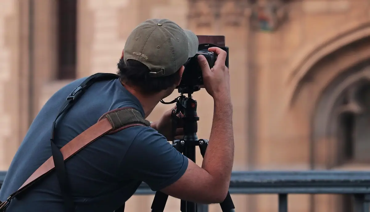 Man, photographer, hobby — illustrating How to Calculate Aspect Ratio for Images and Video
