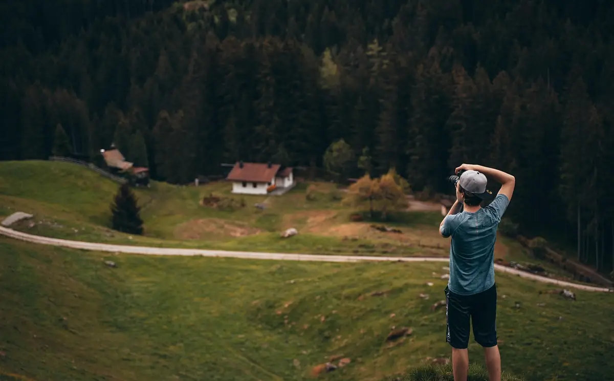 Photographer, man, mountain — illustrating Image Format Guide