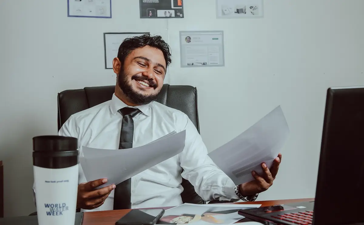 Man, business, workplace — illustrating How to Write Payment Terms on an Invoice (2026 Guide)